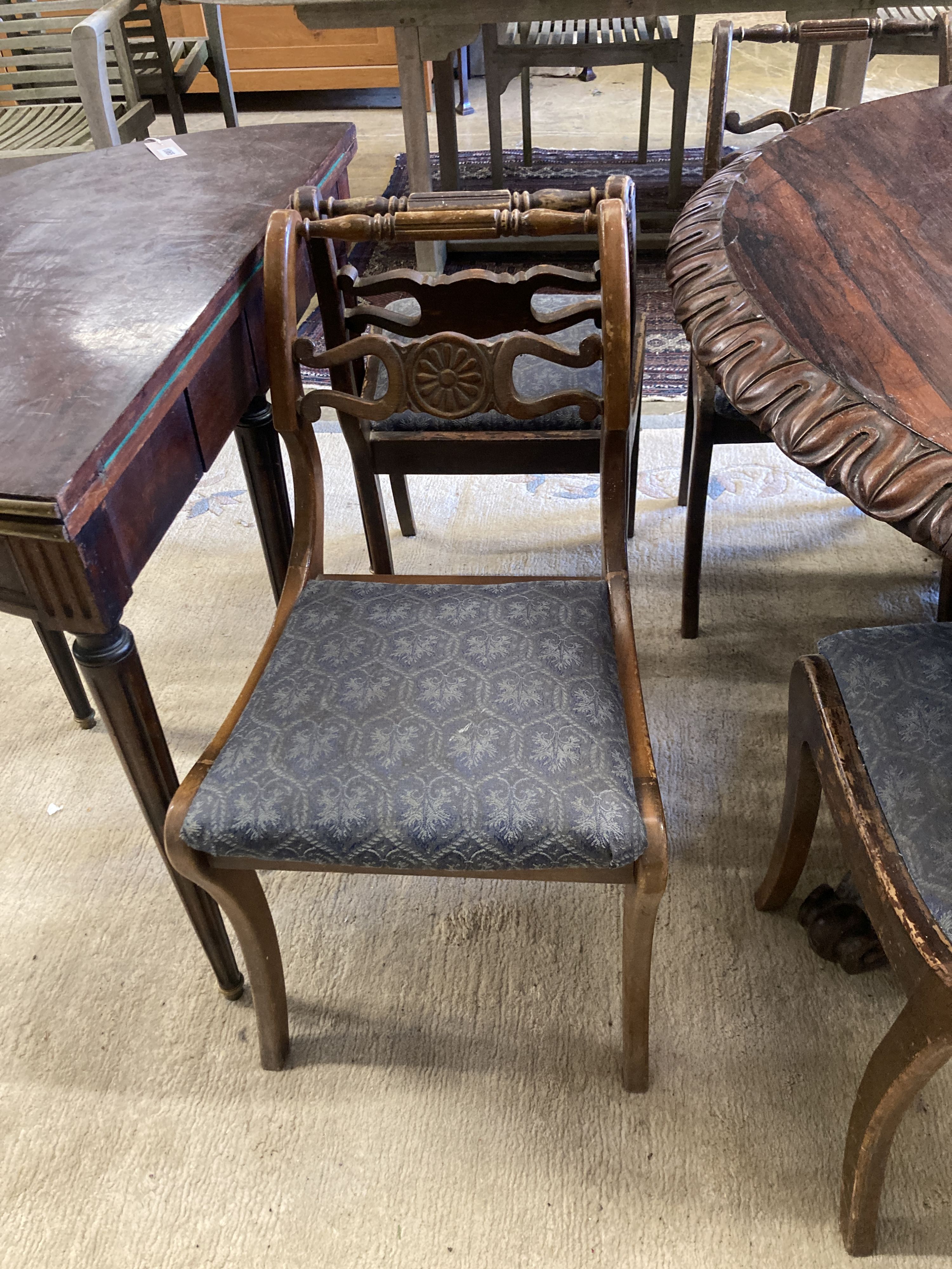 A set of eight Regency style beech dining chairs, two with arms